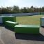 Betonglekplats InsideOut Box Svängd Betong R4819 vid fotbollsplan.